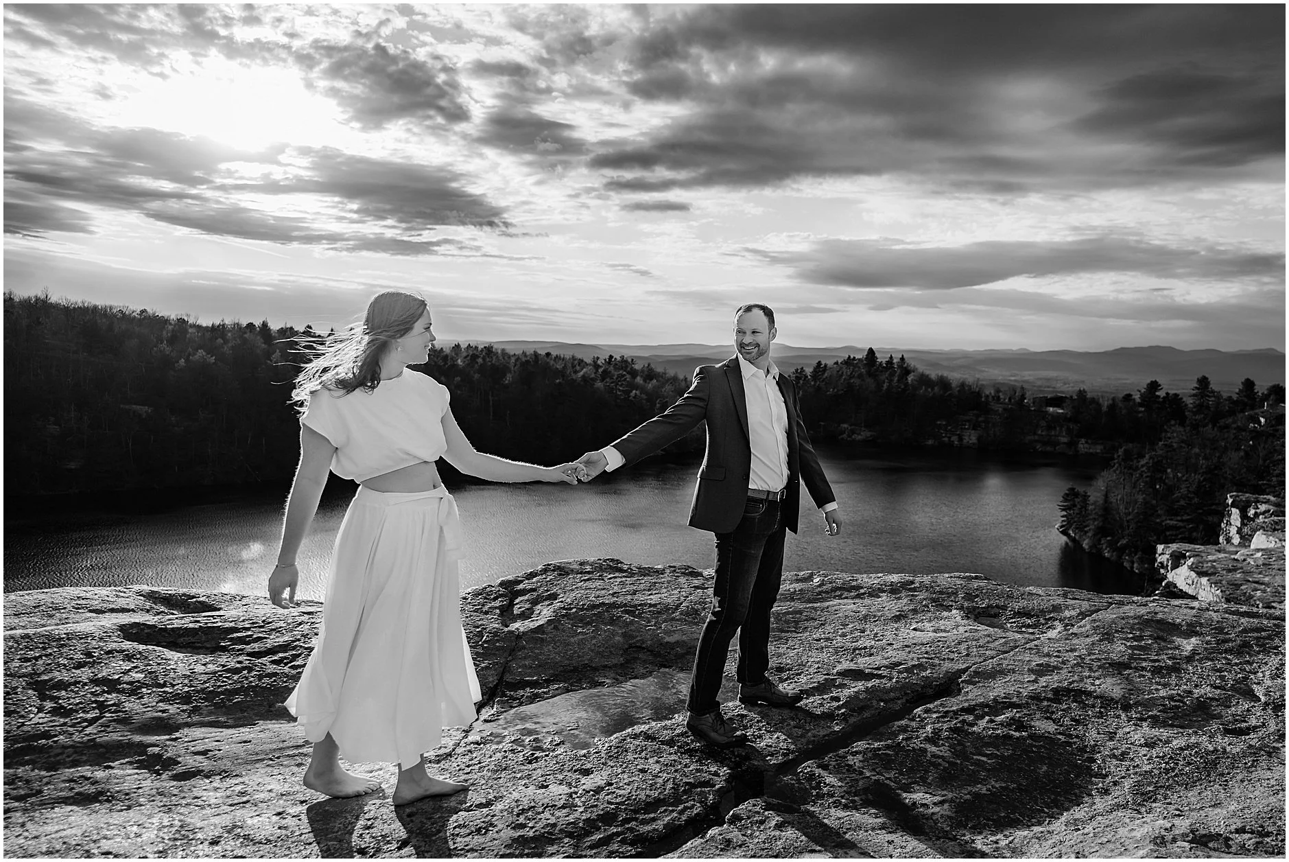 Couple walking hand in hand during engagement photos in the Catskill Mountains