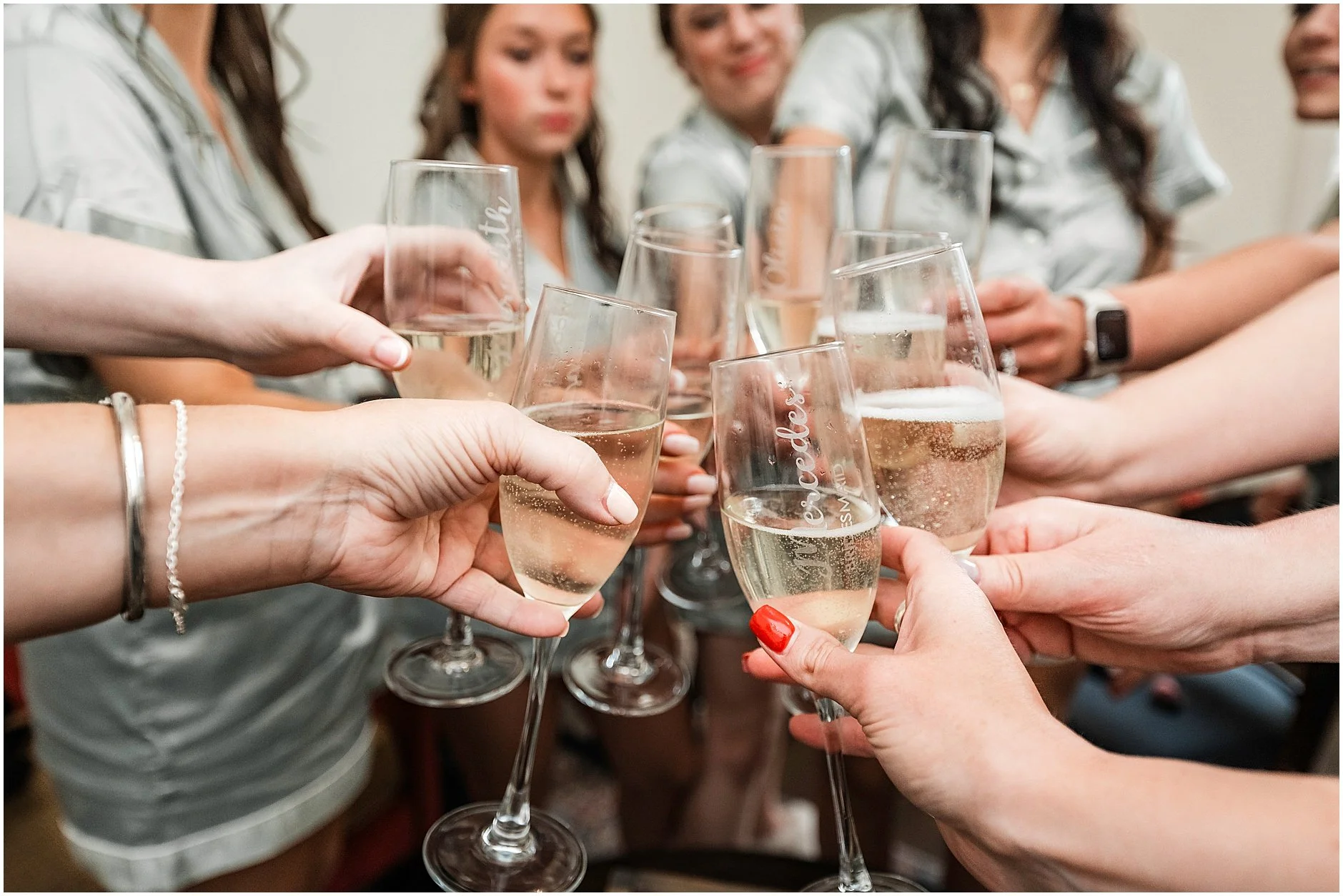 Bridesmaids going in for a cheers before getting dressed for their Upstate, NY wedding.