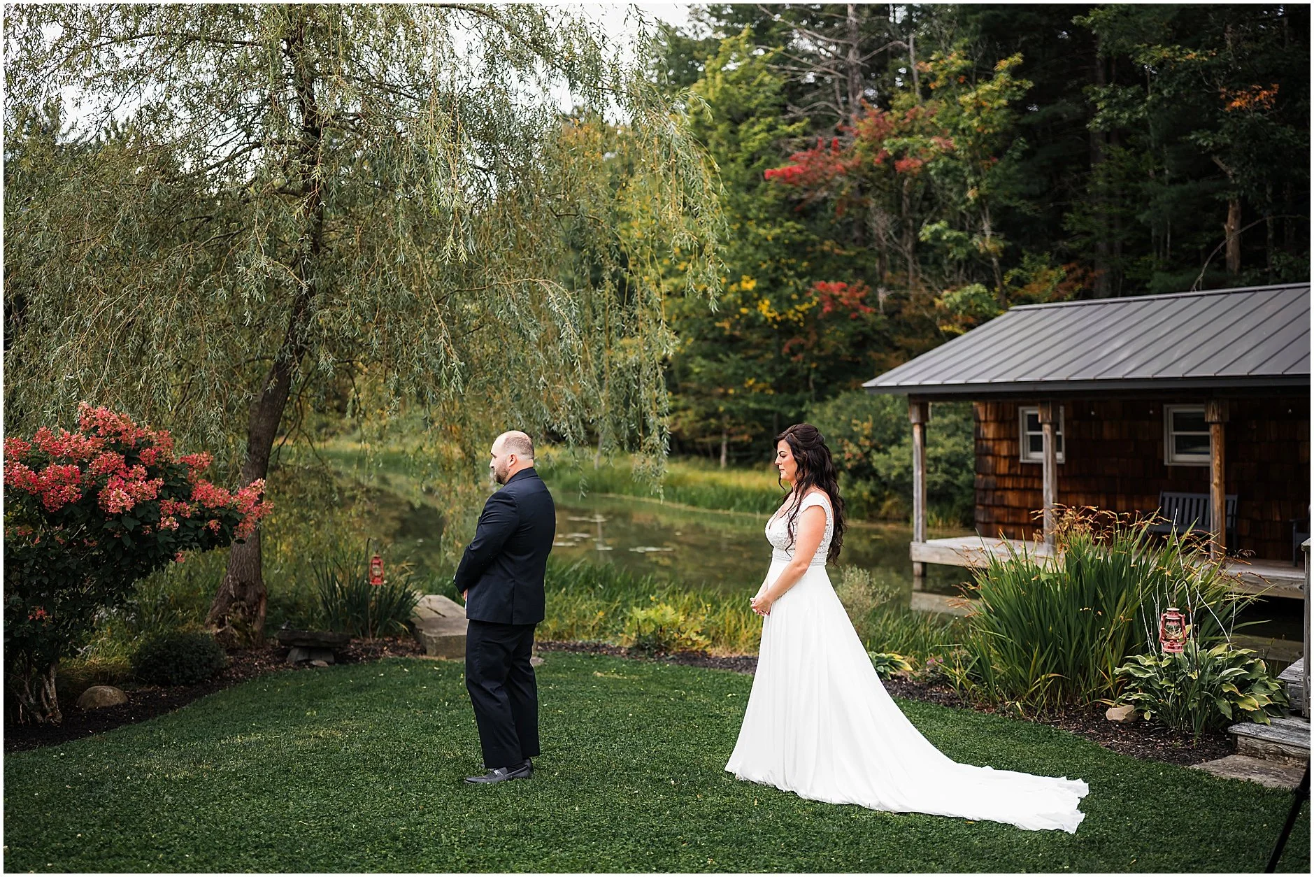 Bride and groom sharing a first look by the water at The Rosemary at Spano Lake
