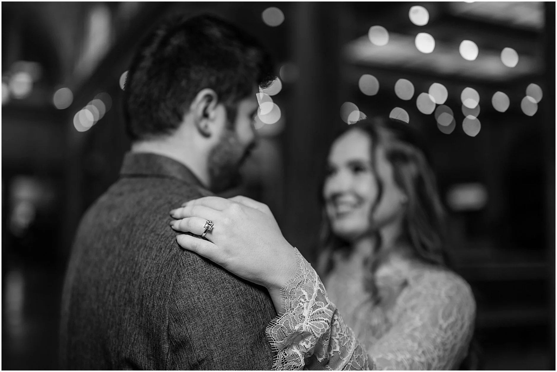 Spring engagement photos of couple at a historic train station, highlighting the architecture and atmosphere of the location.