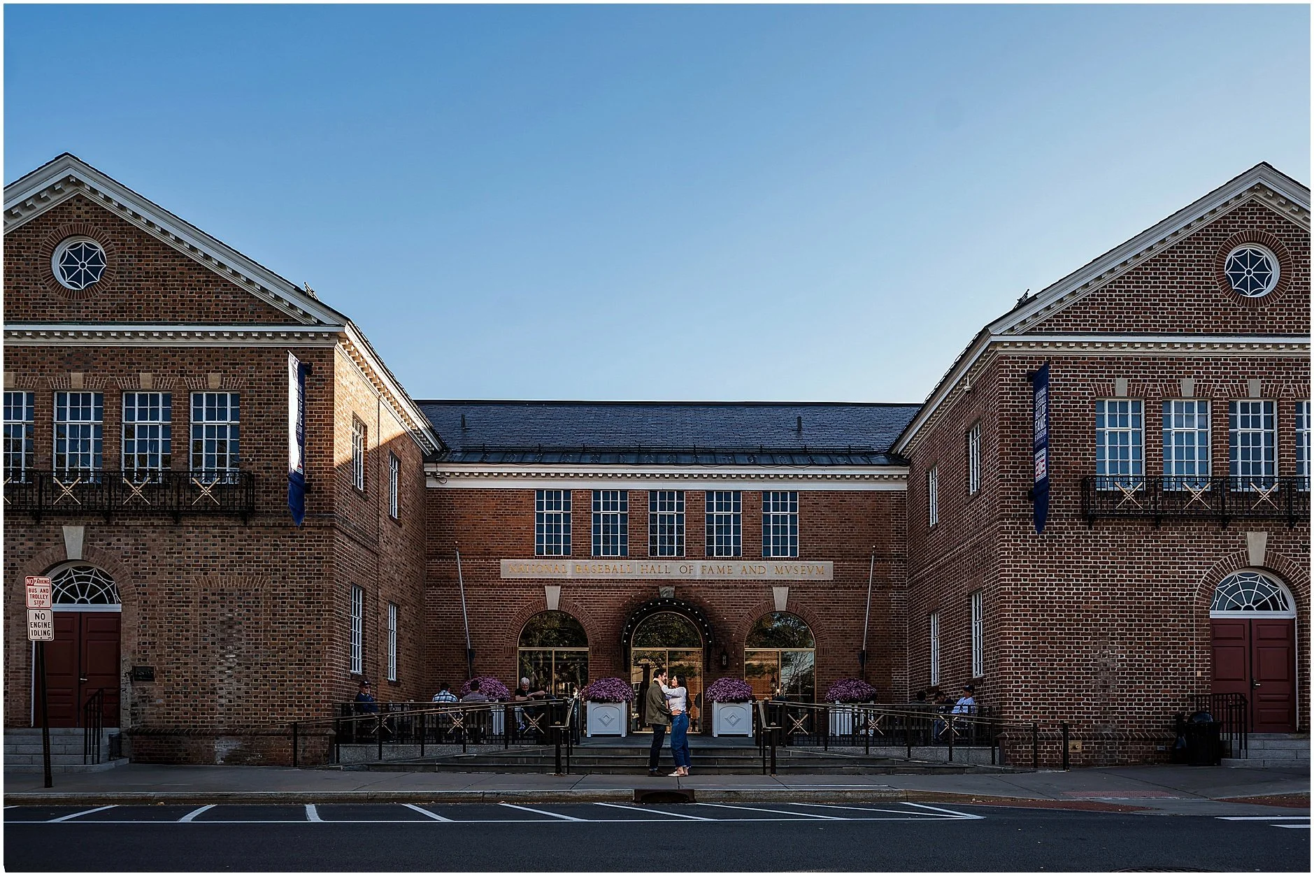 Engagement photo outside National Baseball Hall of Fame in Cooperstown NY