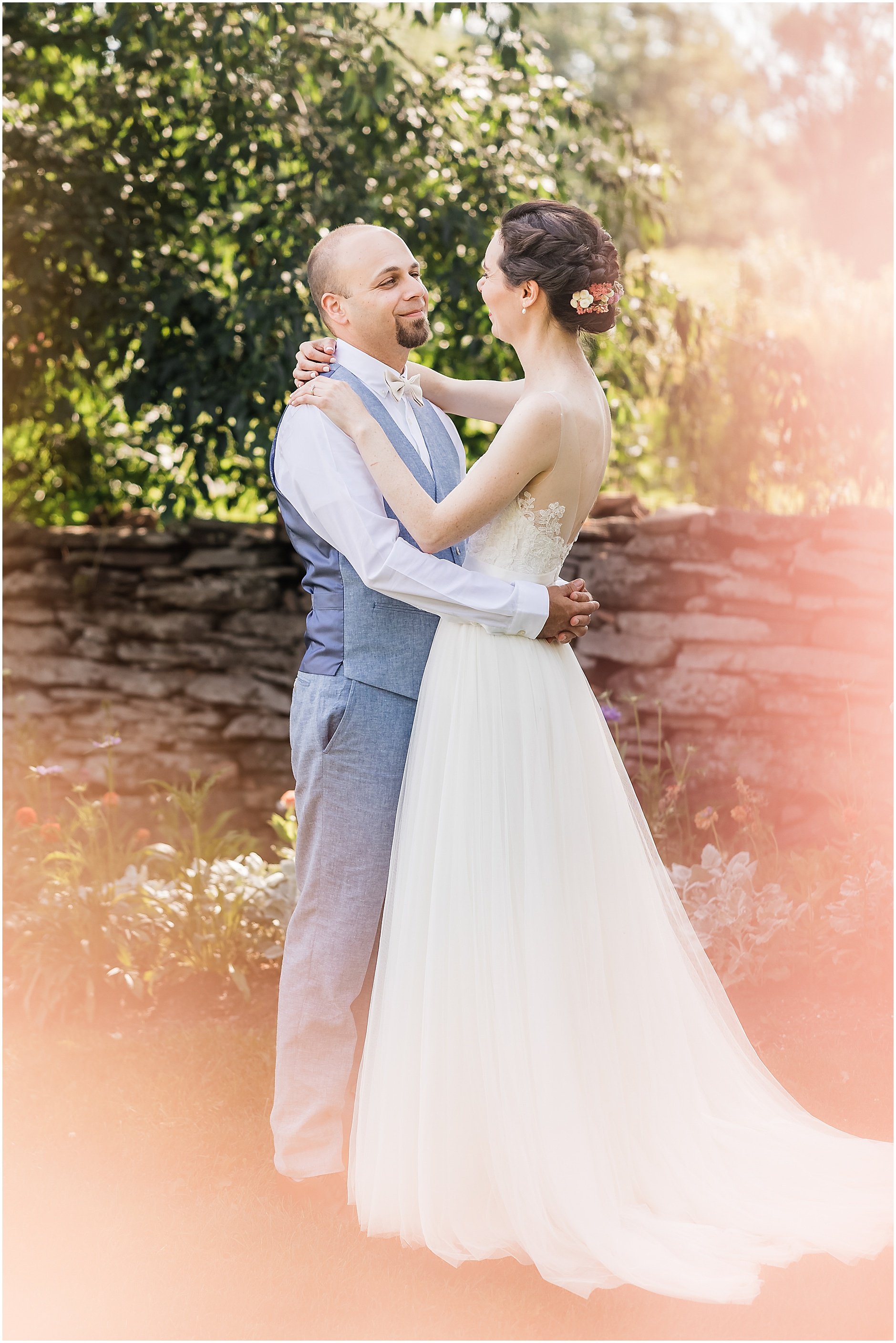Timeless portrait of newlyweds in a garden at The Inn at West Settlement