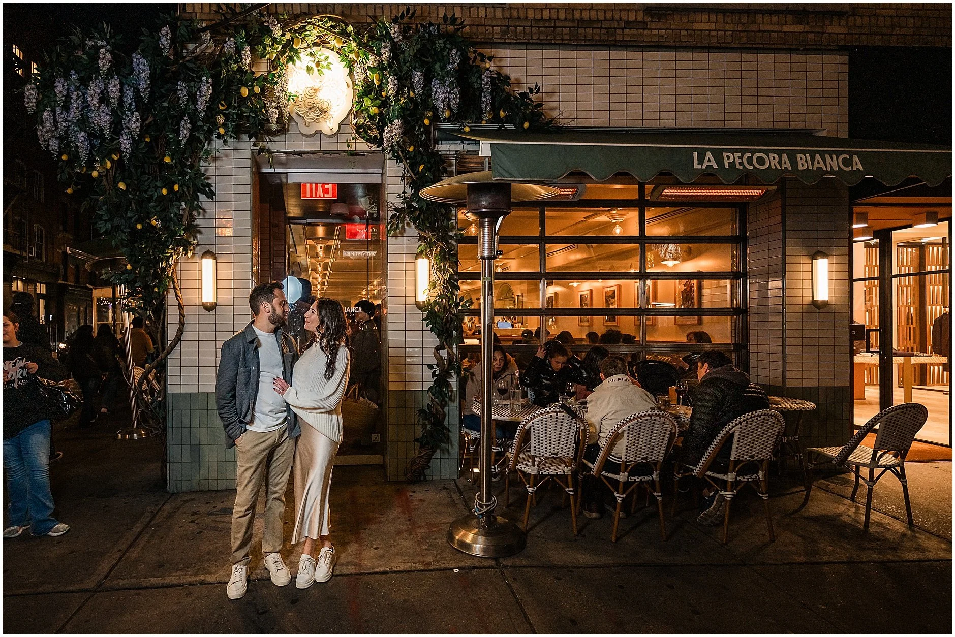omantic engagement photo outside first date location in Soho Manhattan