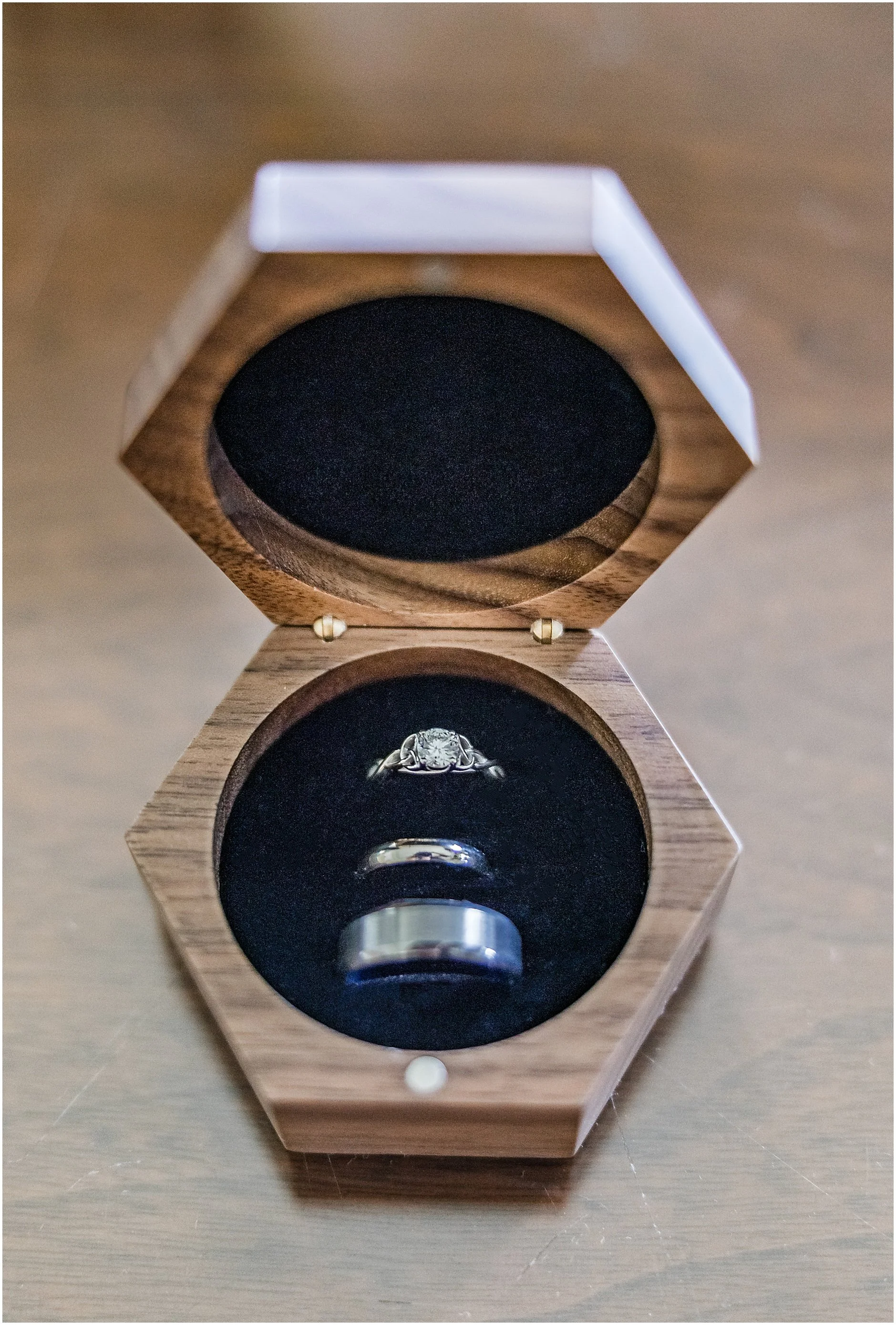 Bride and groom rings in a wooden box