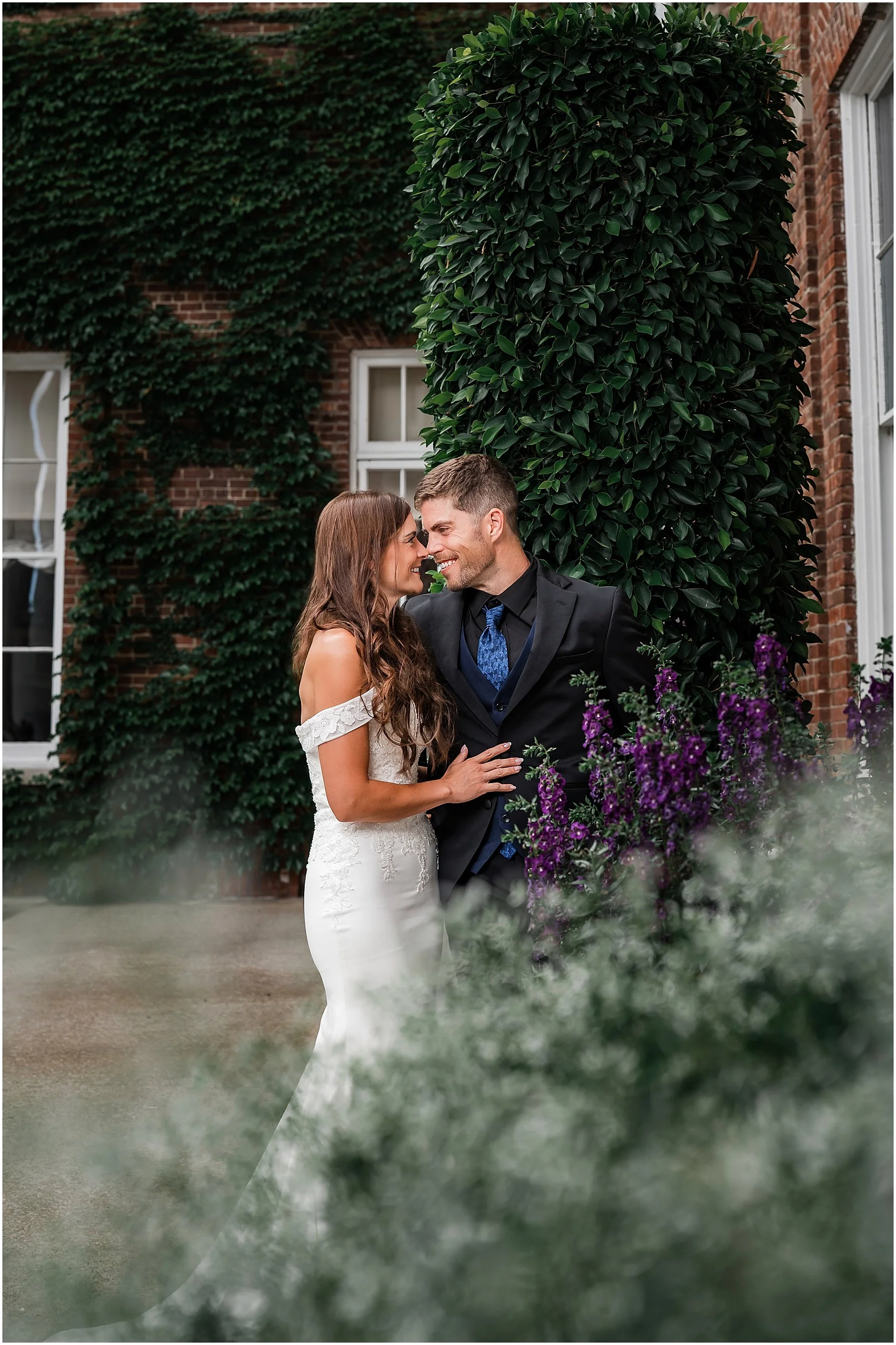 Couple posing for portraits outside The Otesaga Resort Hotel in Cooperstown, New York.