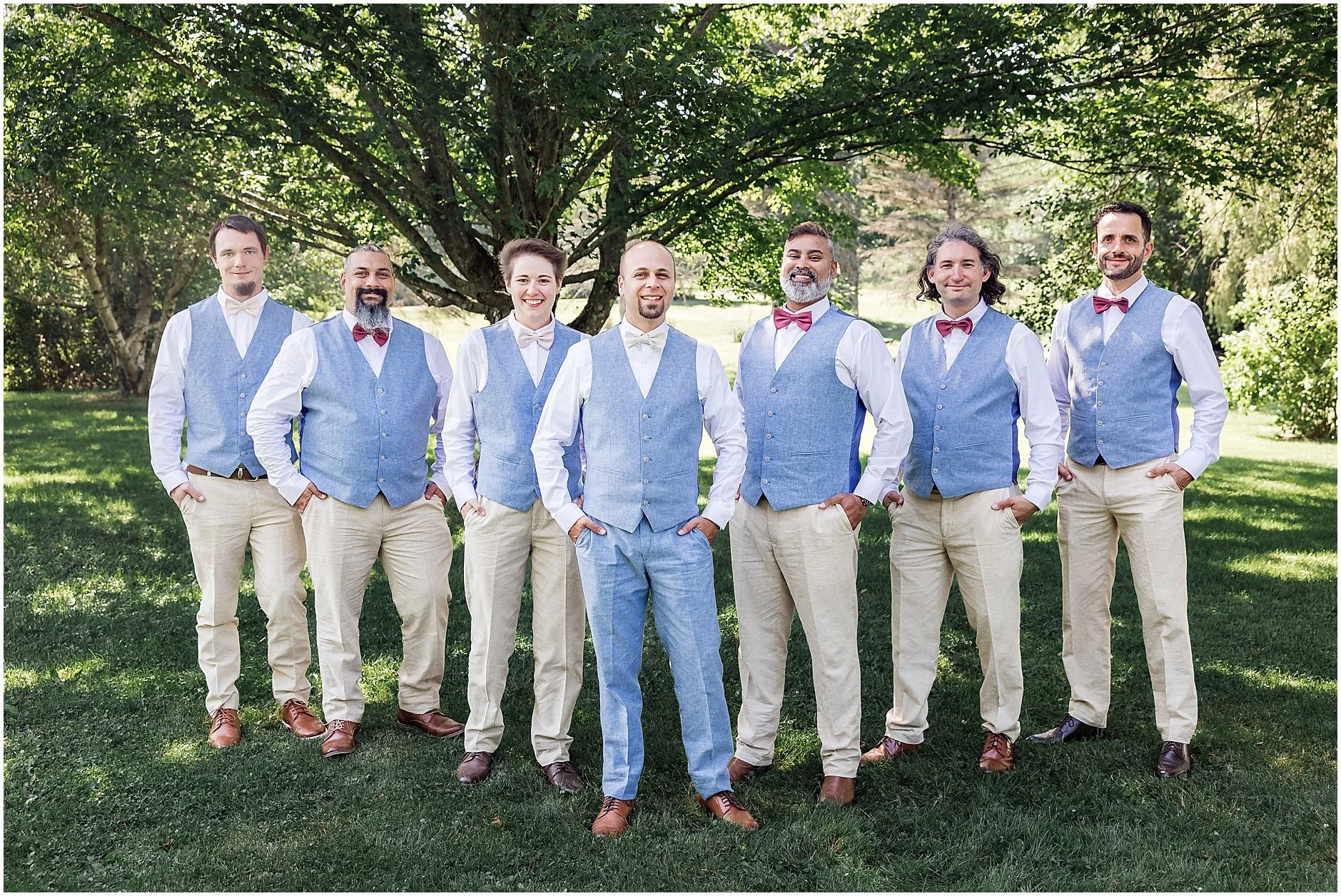 Groomsen standing in a flying v for their portraits at this Catskills New York wedding