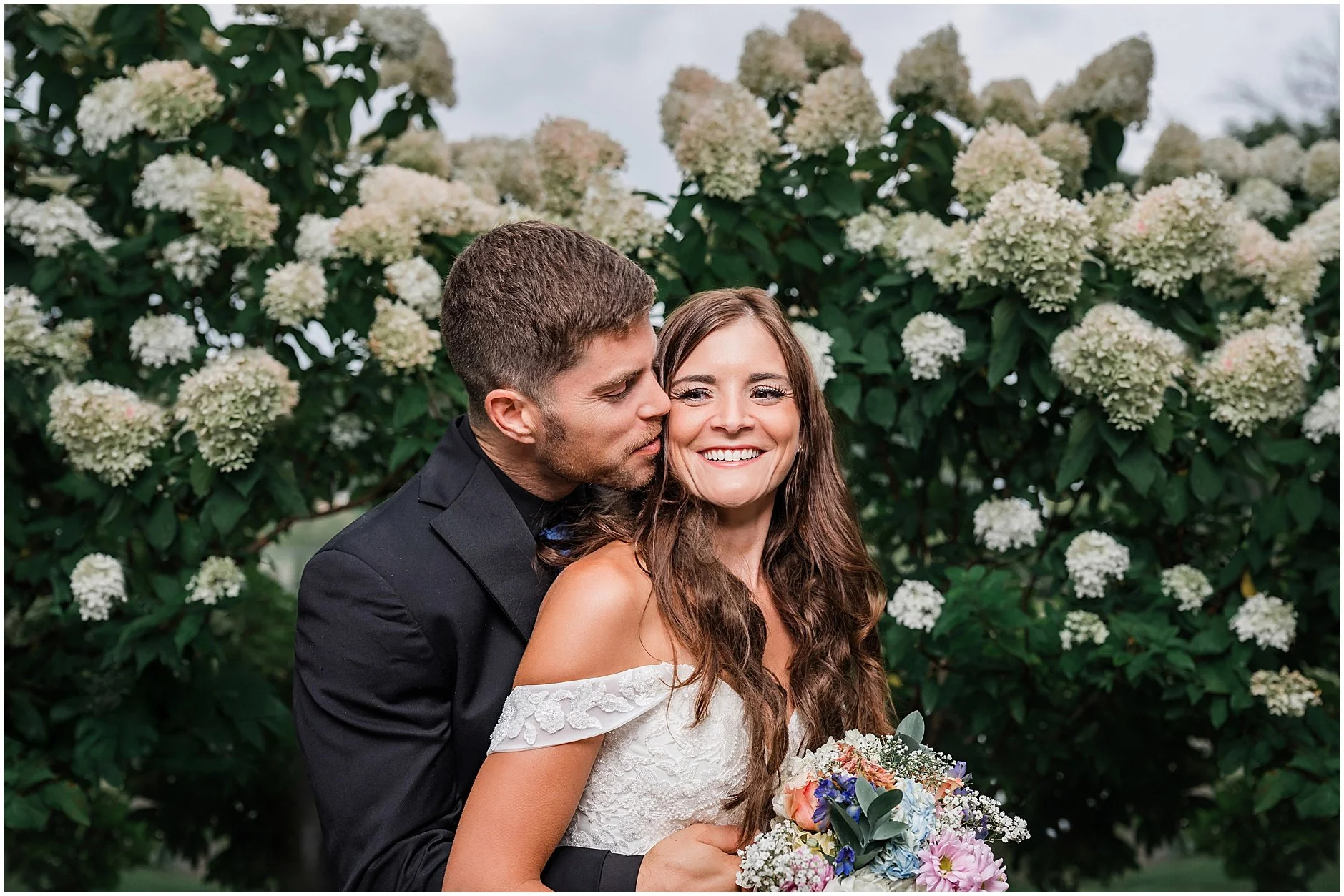 Candid elopement moment between a couple in Cooperstown, New York.