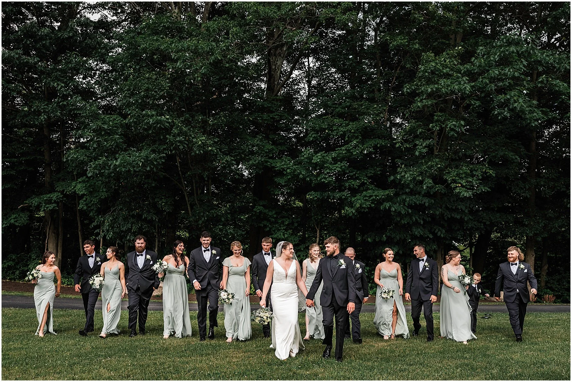 Catskill New York wedding party walking to the reception together.