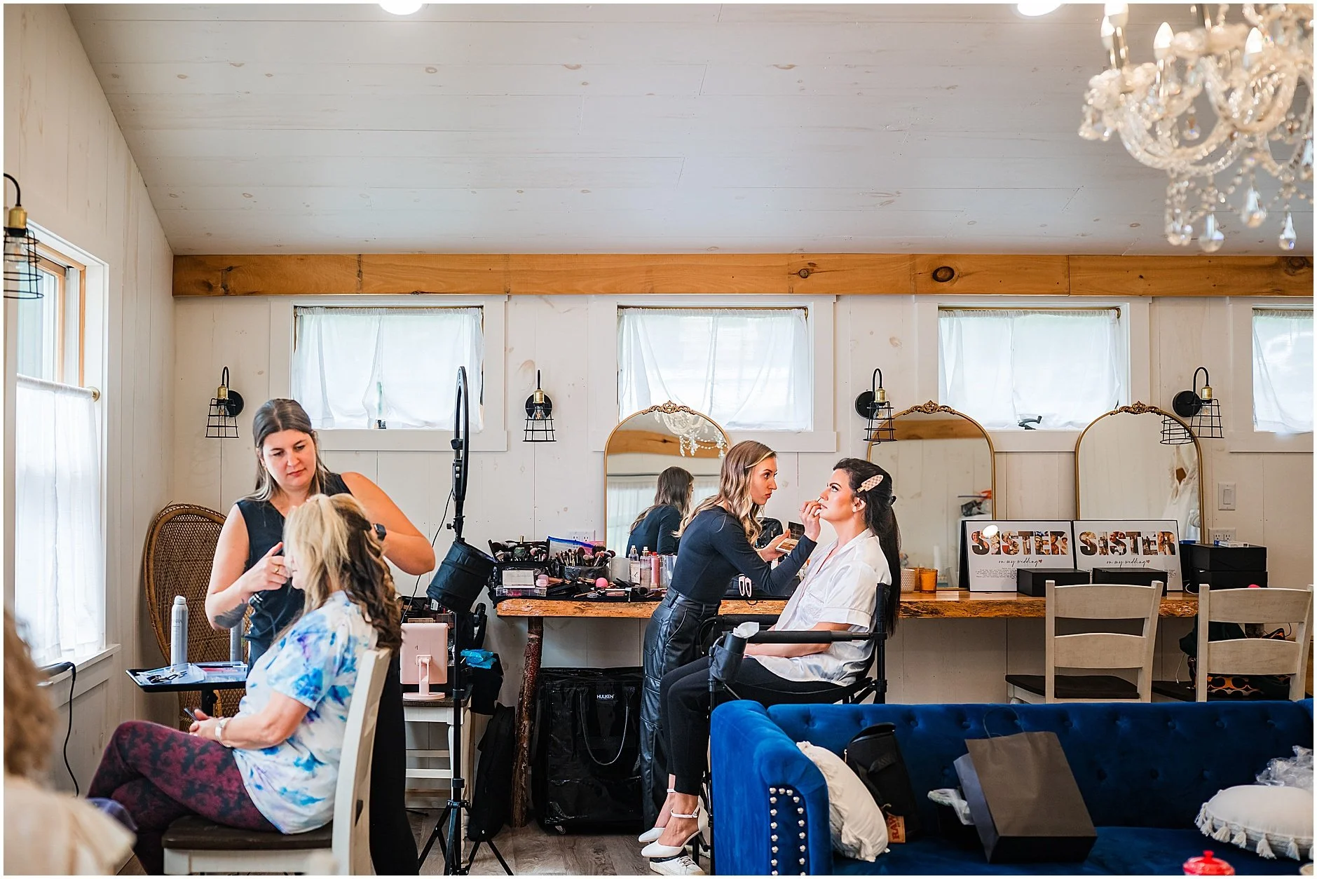 Bride and bridesmaid getting ready before the wedding ceremony at The Rosemary at Spano Lake