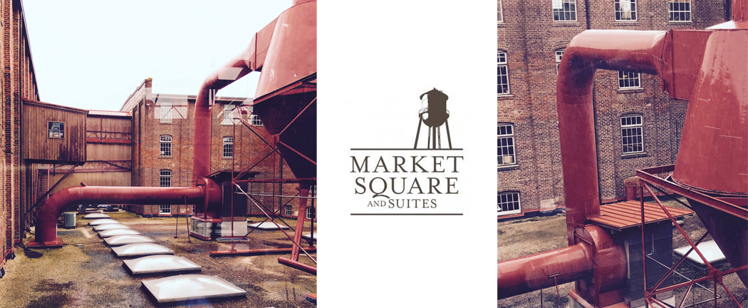 The historic Market Square building is an old furniture factory compound. A five-story brick beauty complete with water towers, covered walk bridges between buildings and gorgeous original hardwood floors through most of the building. 