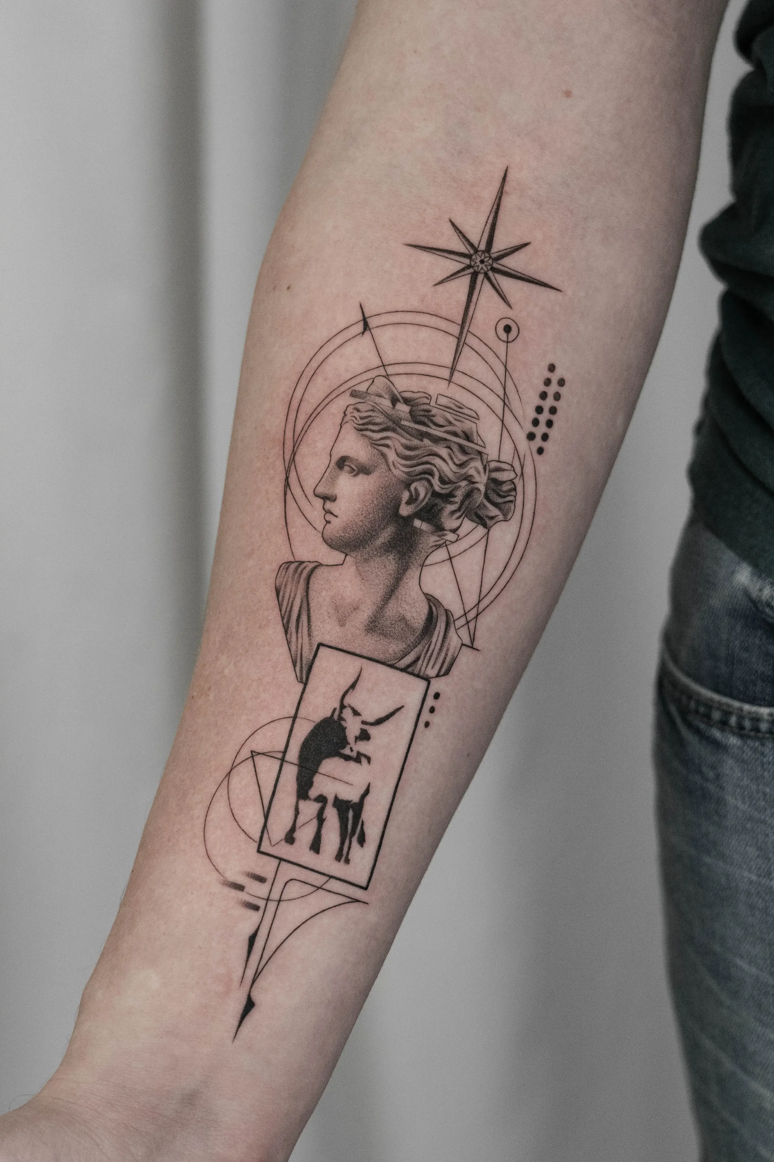 Statue Profile and Taurus Sign Fine Line Tattoo by Gabe Feliciano at The East Tattoo in Orlando Florida 