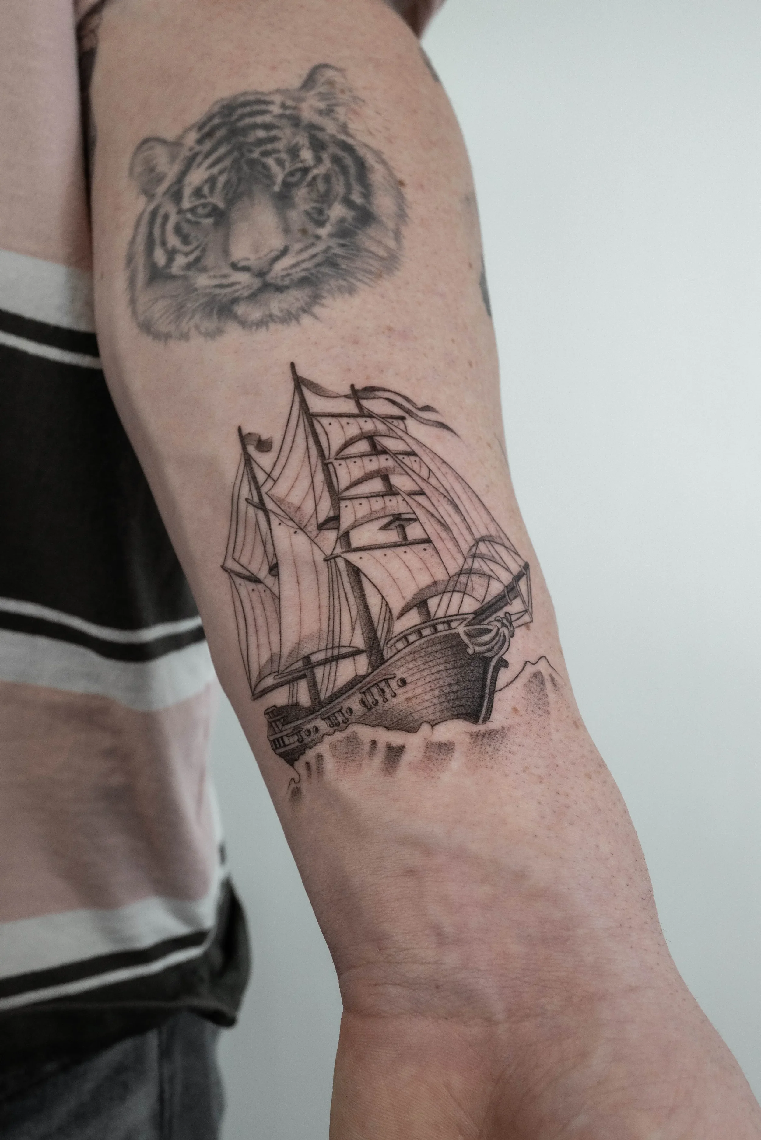 Minimalist Ship Fine Line Tattoo by Gabe Feliciano at The East Tattoo in Orlando Florida 