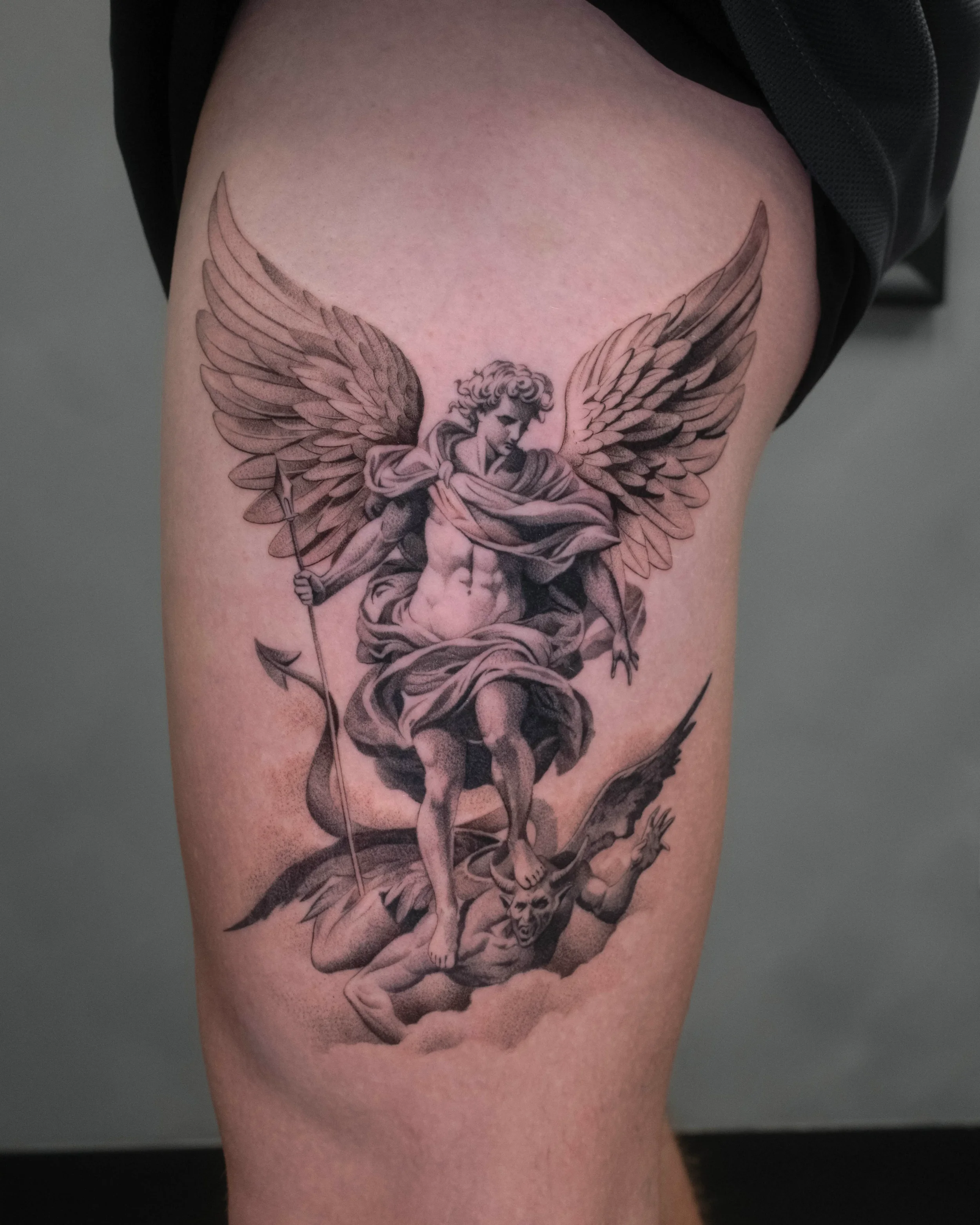 Saint Michael and Demon Fine Line Tattoo by Gabe Feliciano at The East Tattoo in Orlando Florida 