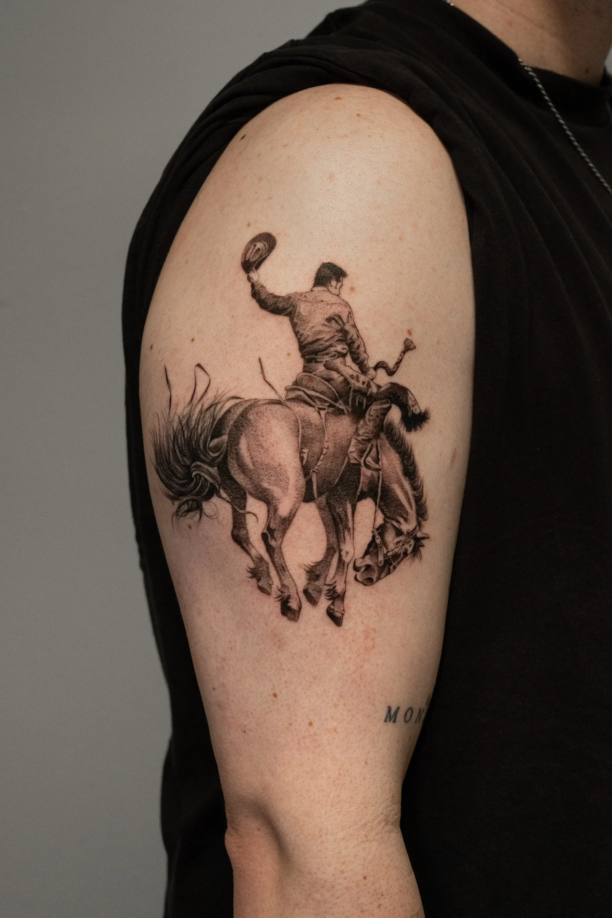 Cowboy Riding a Bucking Bronco Fine Line Tattoo by Gabe Feliciano at The East Tattoo in Orlando Florida 