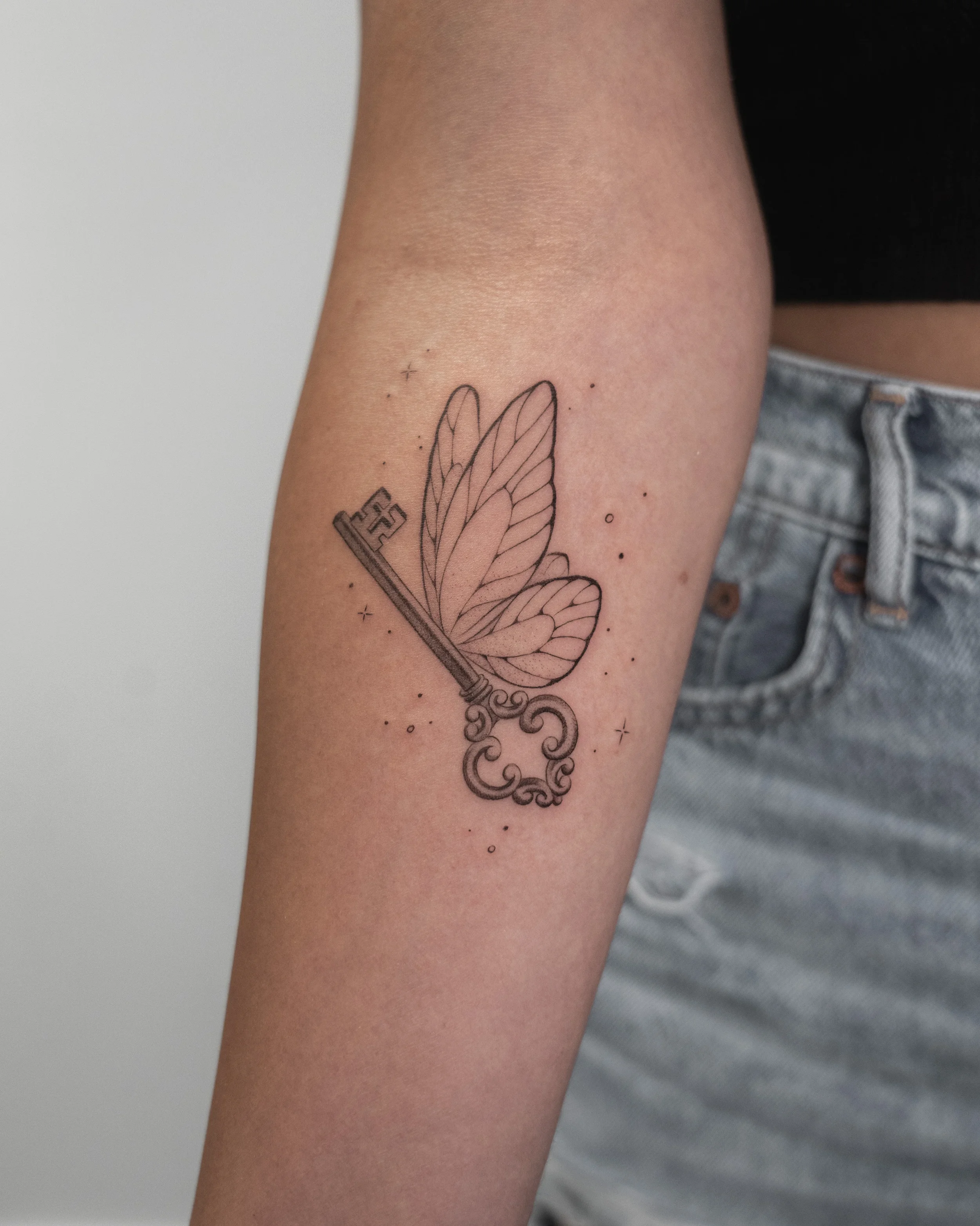 Key Butterfly Fine Line Tattoo by Gabe Feliciano at The East Tattoo in Orlando Florida 