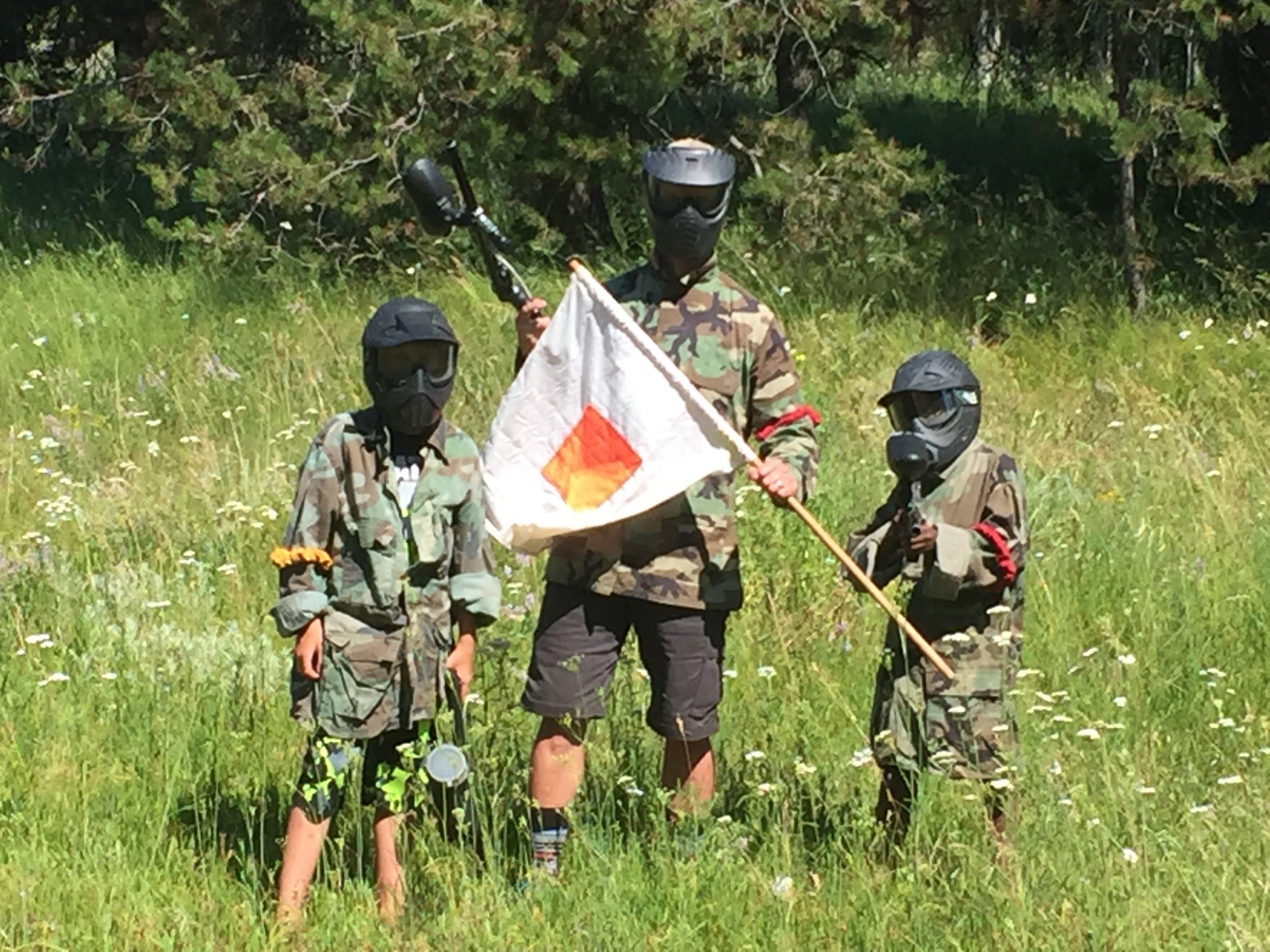 Father and his 2 sons after capturing the flag.
