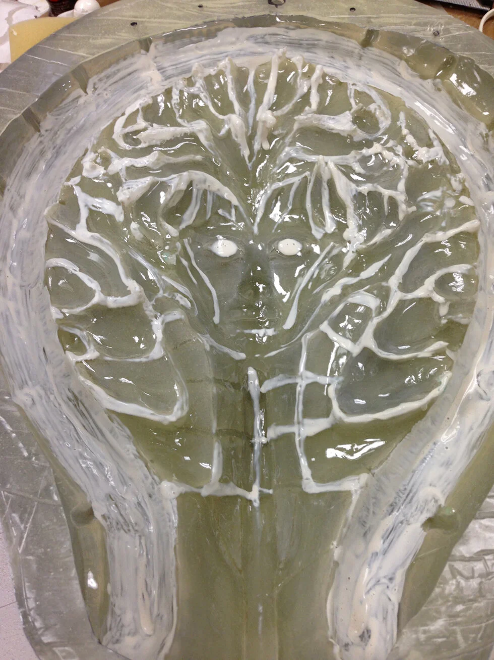 This is where it gets tricky. Above is an image of the back of the sculpture. Here, I identified the low spots and other areas on the surface that I wanted the white LED’s to shine through and painted them in liquid latex on the back.