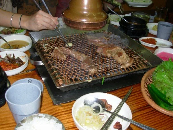 Cooking on a grill at a restaurant table - I may be a vegetarian now, but I sure would not have made it through two years in Korea. 