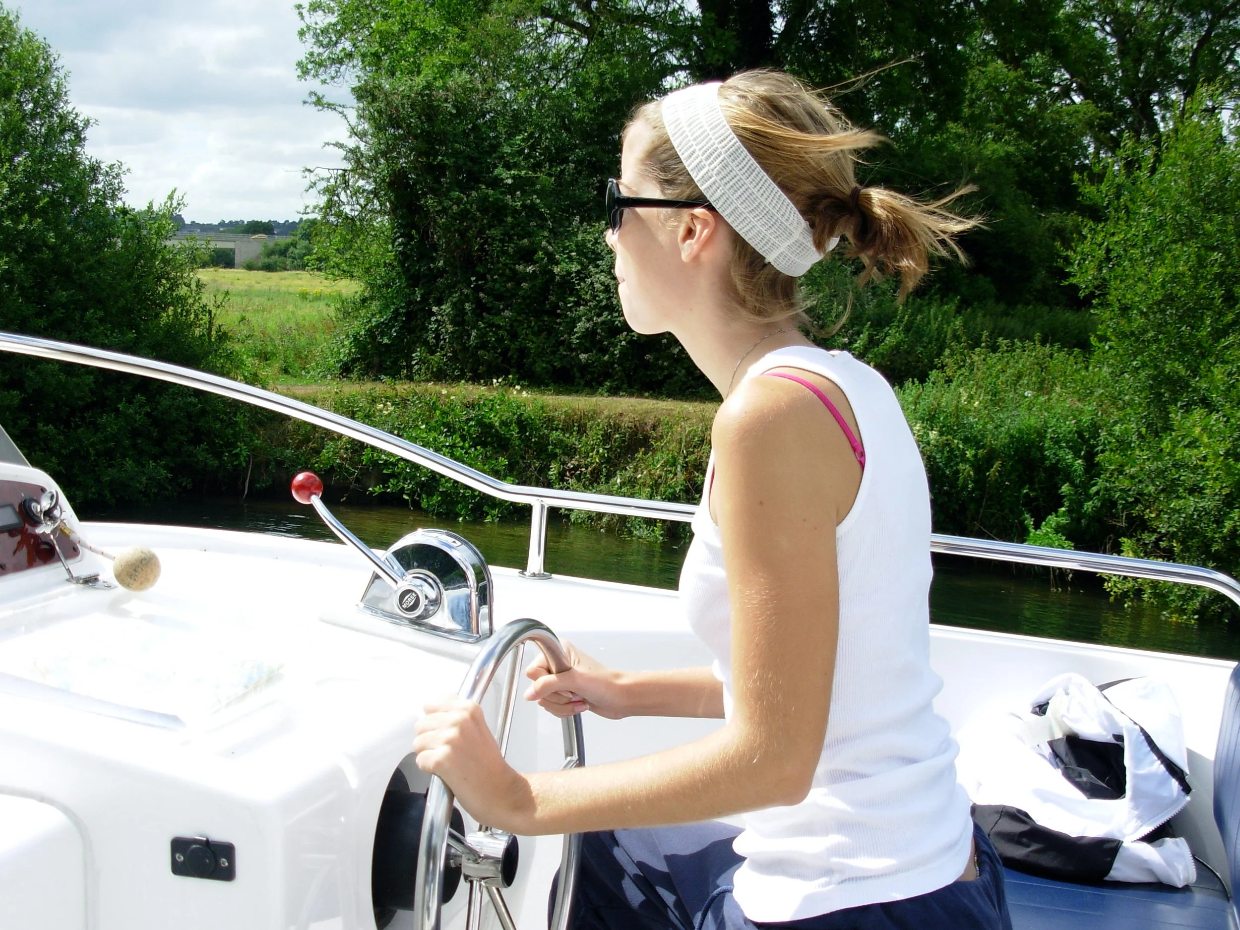 My family rented a boat and sailed down the Thames for a week. (Check out my concentration as I take a turn behind the wheel.) If almost capsizing the boat in a lock is "once-in-a-lifetime" and unique, we had a very luxurious trip. 