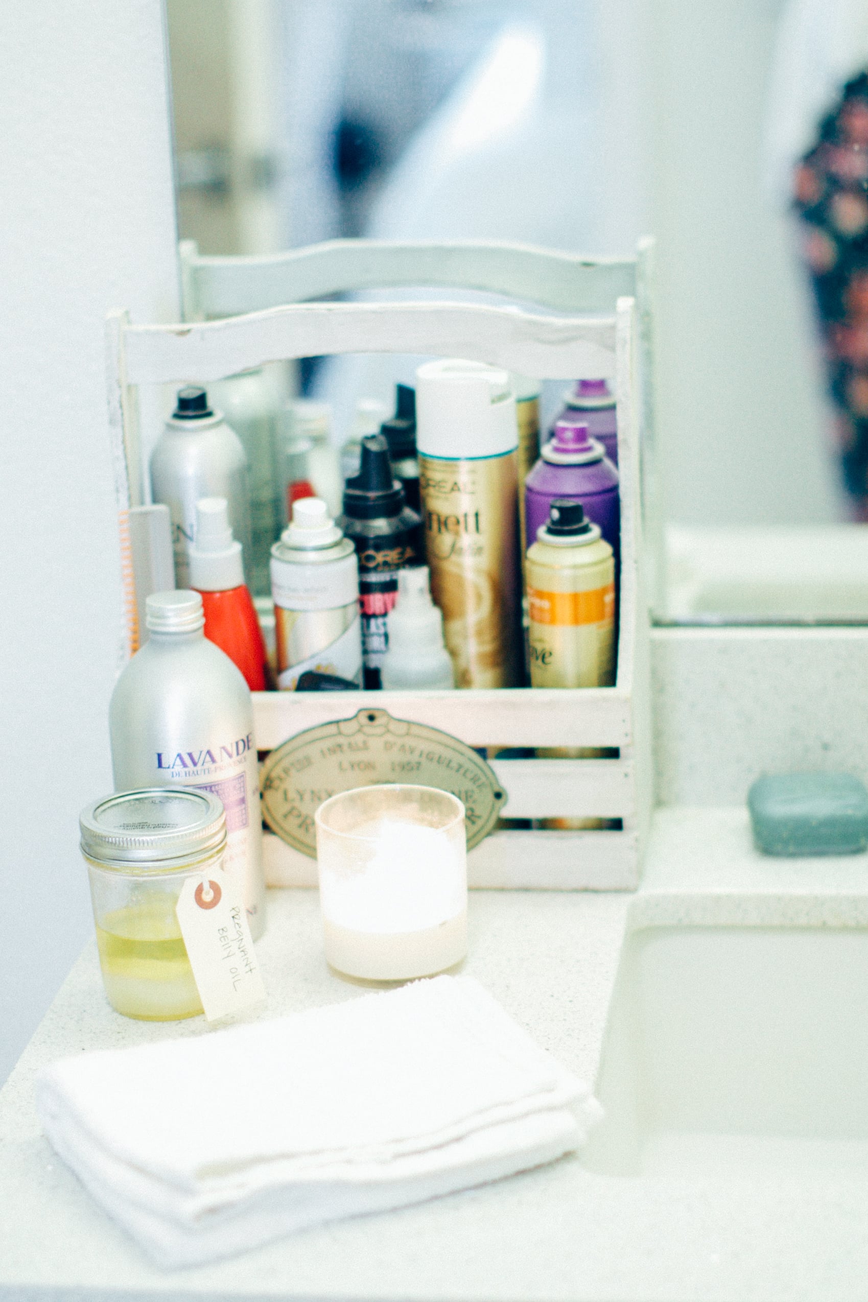 The sink area. my favorite hair spray ever is the gold one behind. it's used by victoria's secret models for shows -- i love it because it stays and doesn't rat up your hair :) 