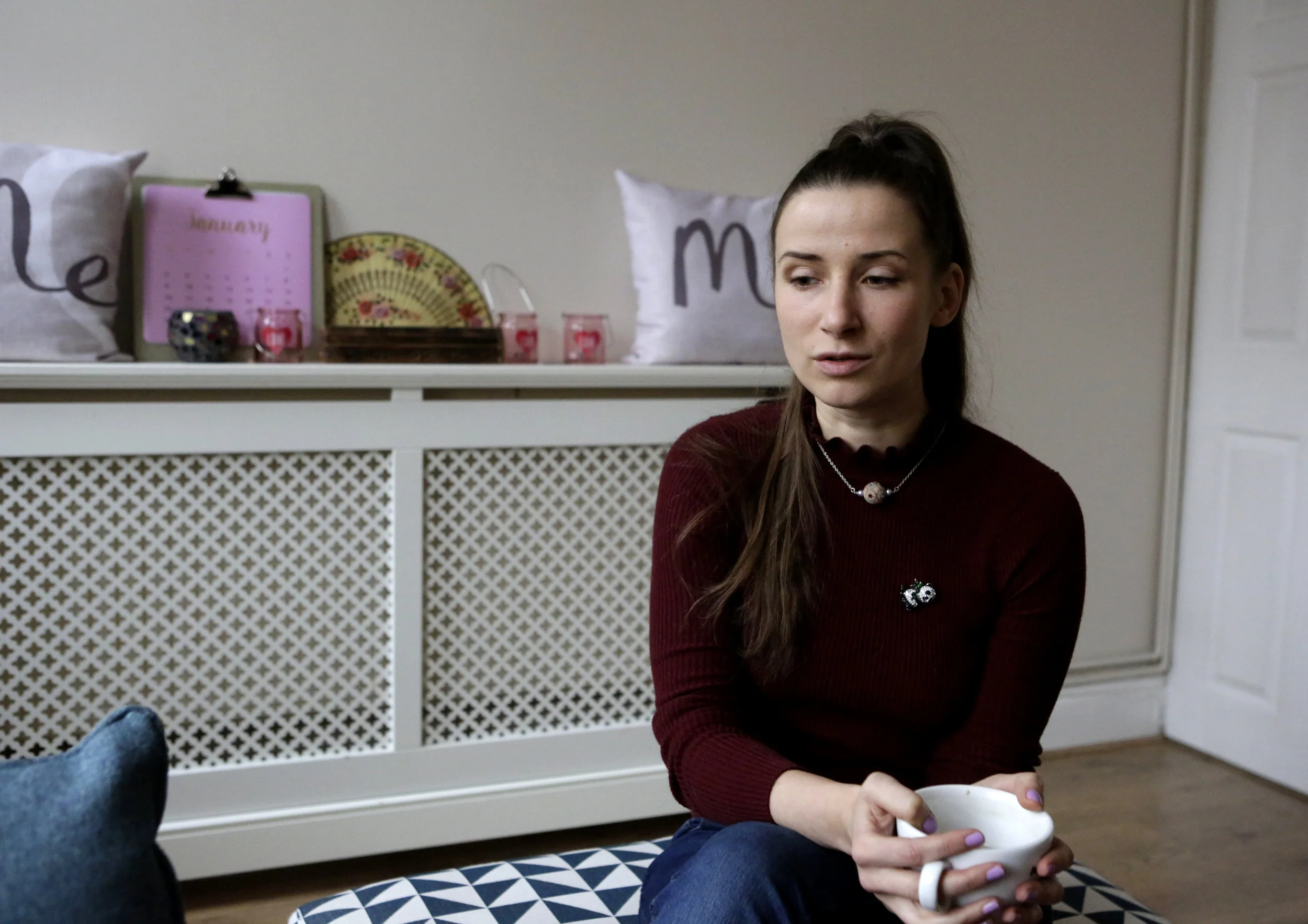 Rimante, a purchasing assistant from Lithuania, in her sitting room. Nottingham, 2017.