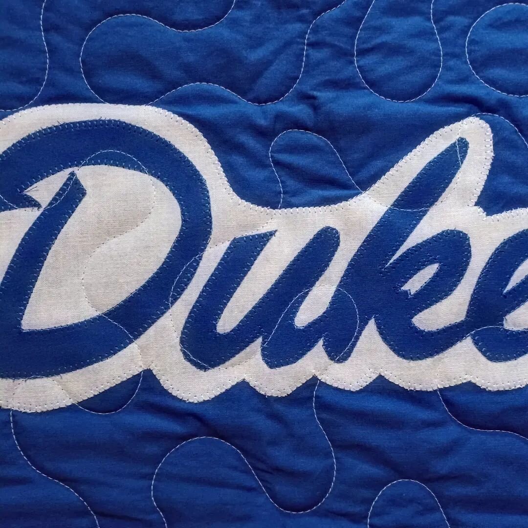 Sometimes college quilts need a little applique! 
#finishedfibers #makingquiltedmemories #tshirtquilt #togetherwesew #tshirtquilts #texture #customquilts #applique #apqslenni #inmystudio