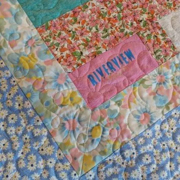 Memory Quilt using t-shirts, other clothing fabrics, and vintage pillow cases.