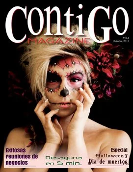 Woman with Día de Muertos makeup and elaborate floral headpiece on magazine cover
