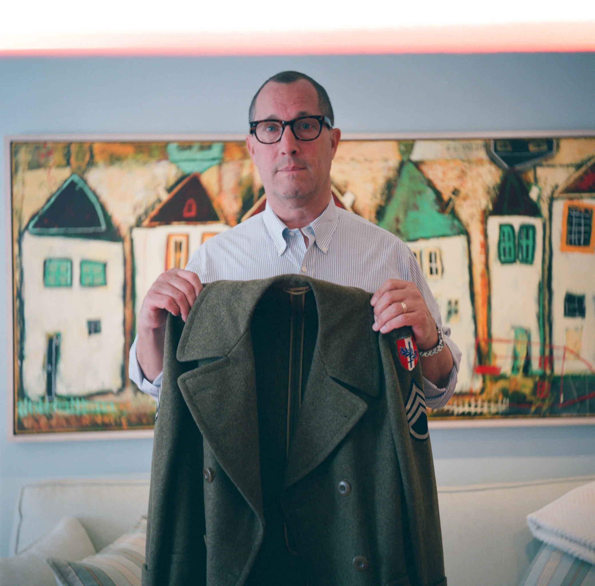 *My father holding my grandfather's service jacket, taken on my grandfather's Yashica TLR*