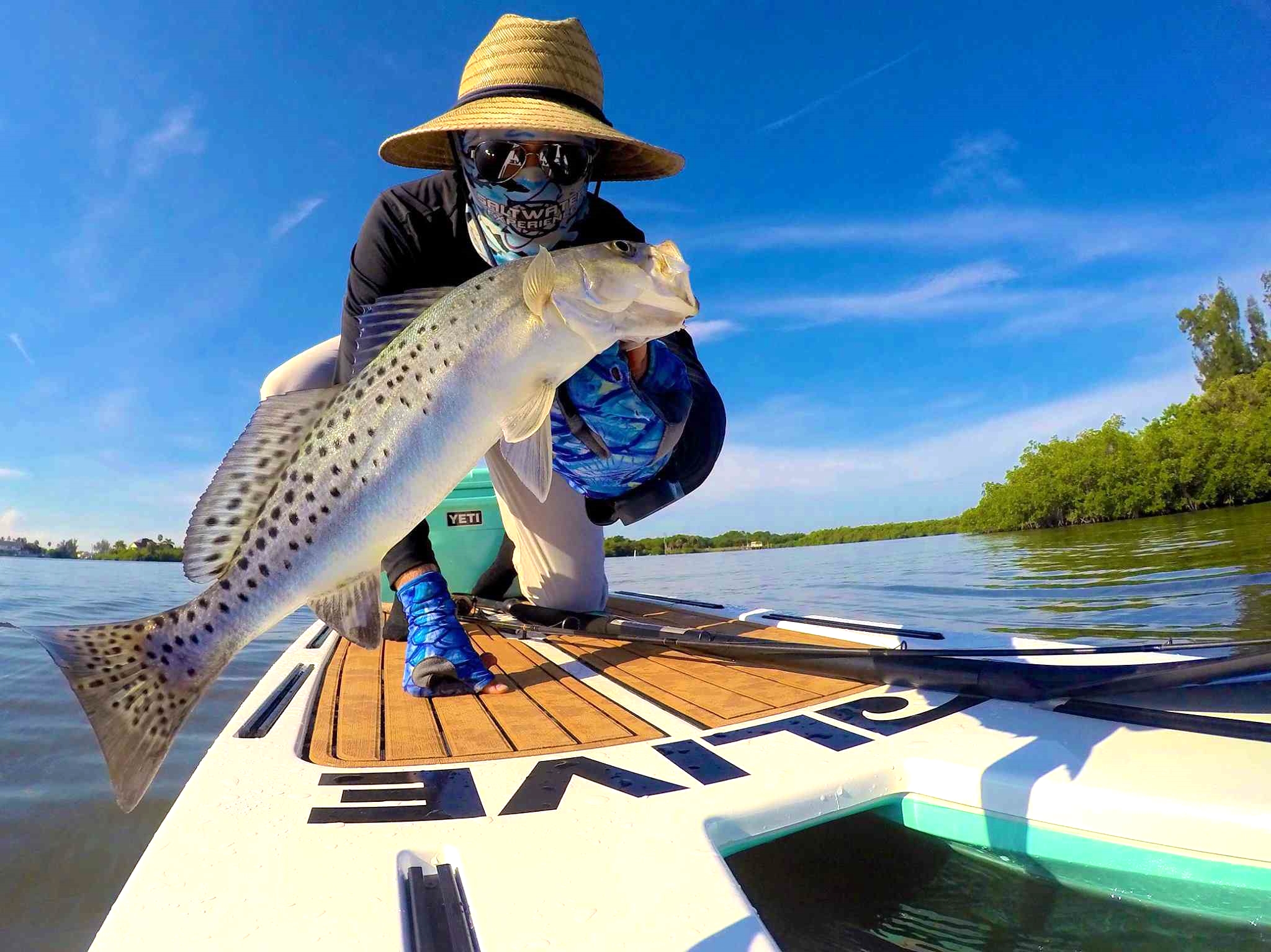 Phil Hughes with one of his many striking catches off his paddle board