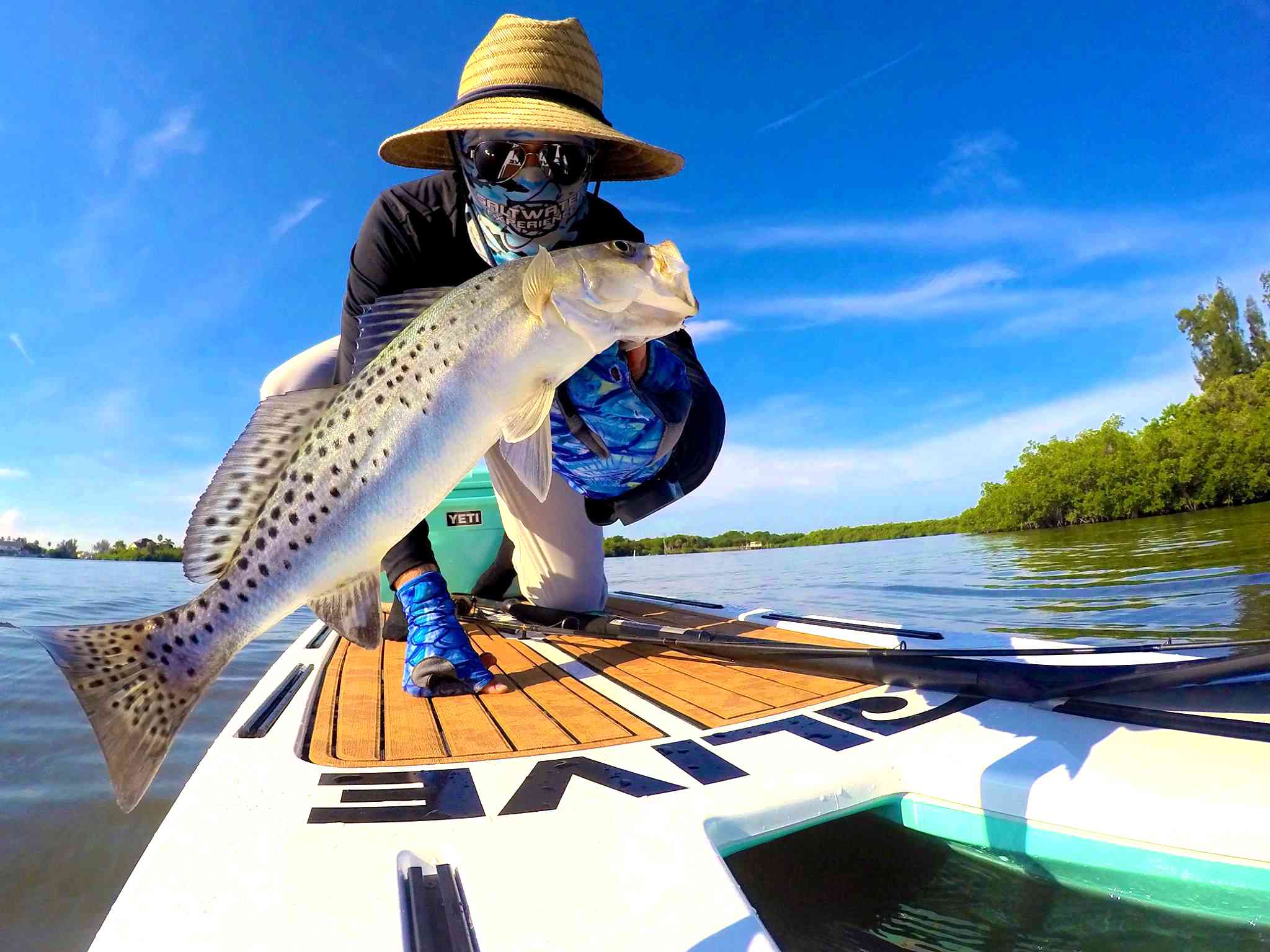 Phil Hughes with one of his many striking catches off his paddle board