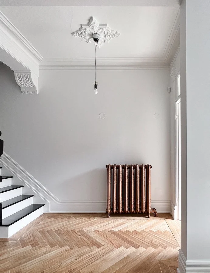 Toronto home renovation - victorian style house - entrance way with ceiling medallion and herringbone floors