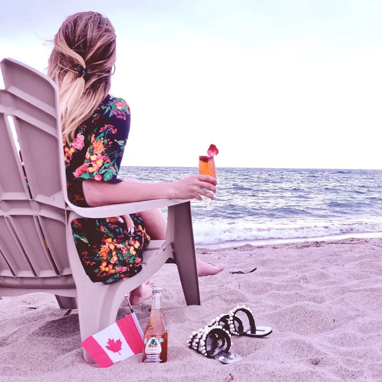 Sitting on the beach having a Strawberry Fizz Cocktail