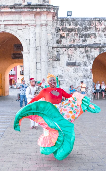 Lady dancing outside the entrance to The Walled City, Cartagena