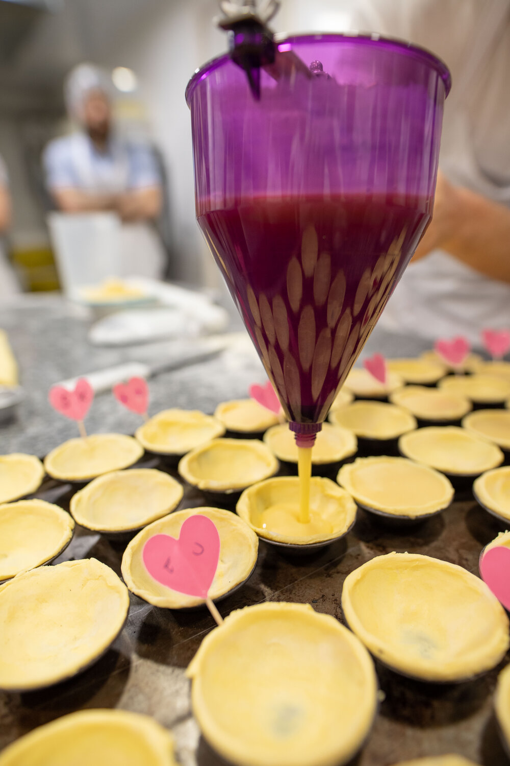 Filling our tarts with custard 