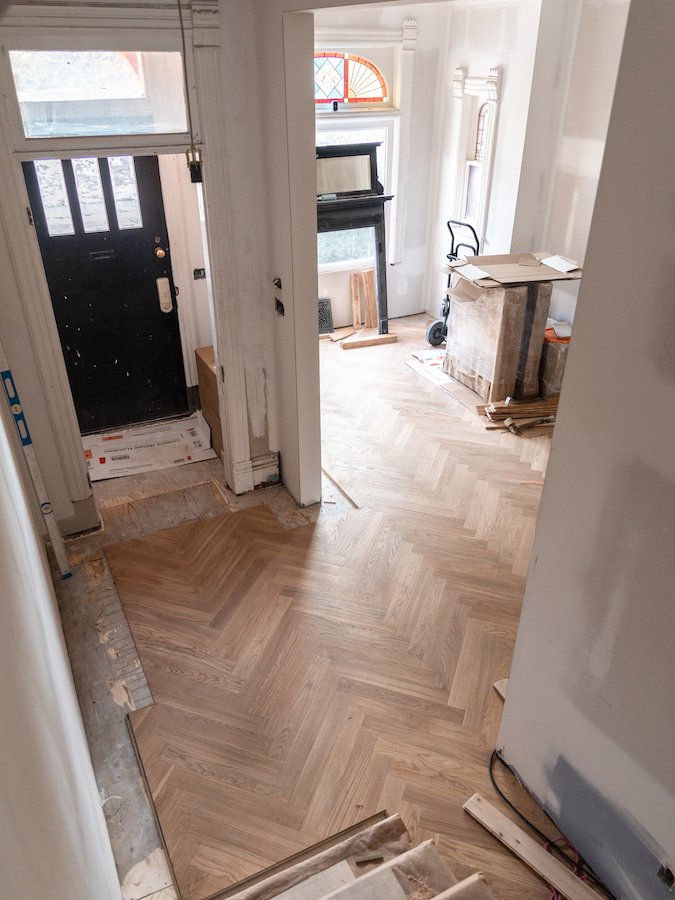 home renovations in Toronto - install herringbone flooring with brass inlay from chestnut flooring-7.jpg
