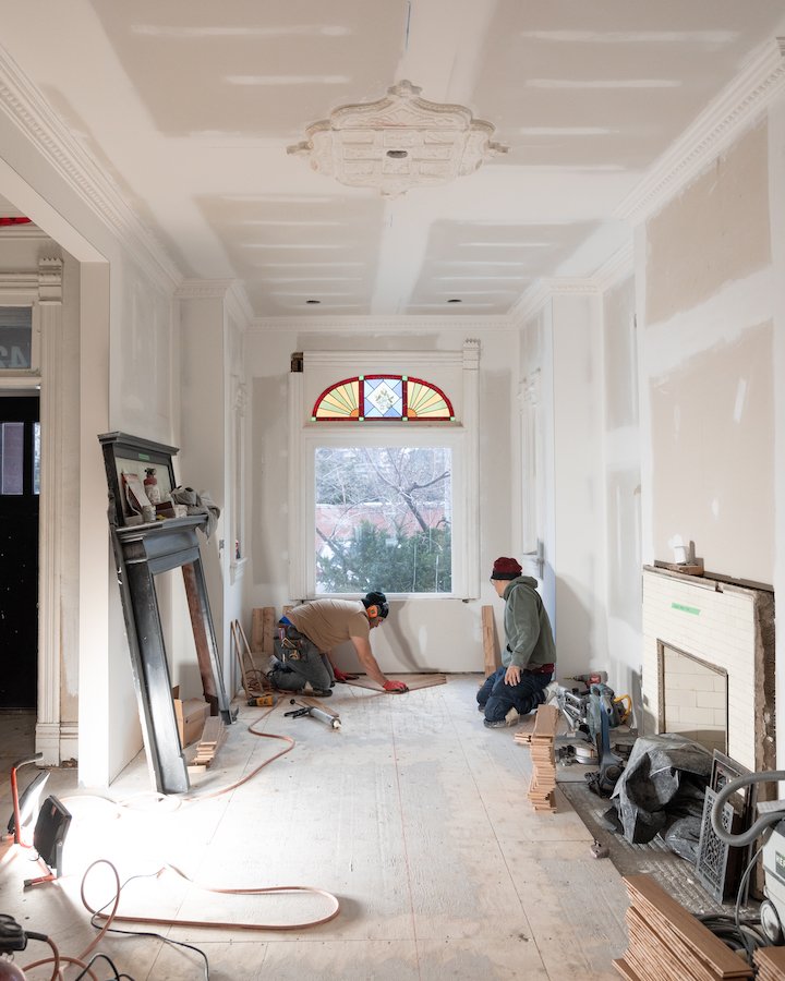 home renovations in Toronto - install herringbone flooring with brass inlay from chestnut flooring.jpg