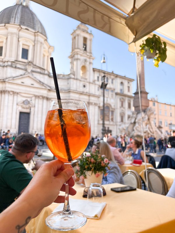 Drinking Aperol Spritz In Piazza Navona