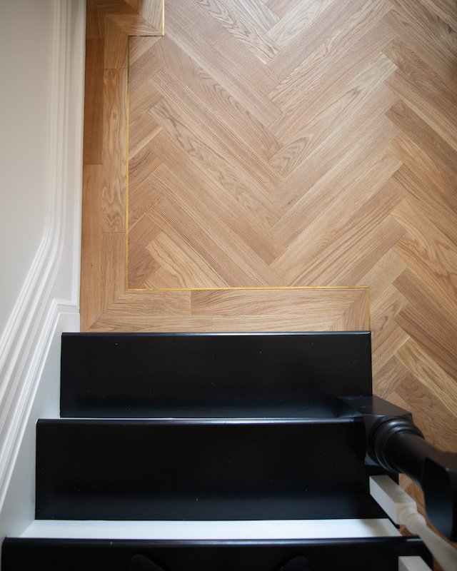 home renovations in toronto - custom staircase with herringbone flooring and brass inlay-4.jpg