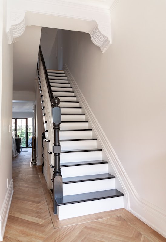 home renovations in toronto - custom staircase with herringbone flooring and brass inlay.jpg