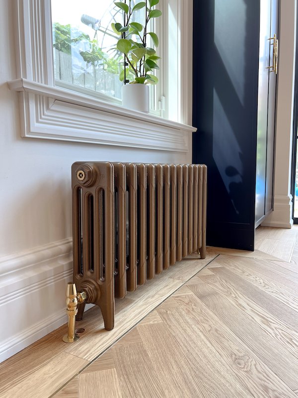 home renovations in toronto - Castrad modern cast iron radiator with herringbone flooring_.jpg