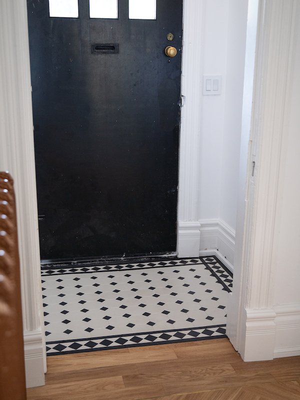 modern victorian house - home renovations toronto - foyer tiles - winckelman tiles black and white victorian tiles with boarder design-4.jpg