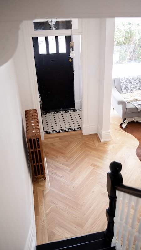 modern victorian house - home renovations toronto - victorian style house foyer tiles - winckelman tiles black and white victorian tiles with boarder design against herringbone floors-2.jpg