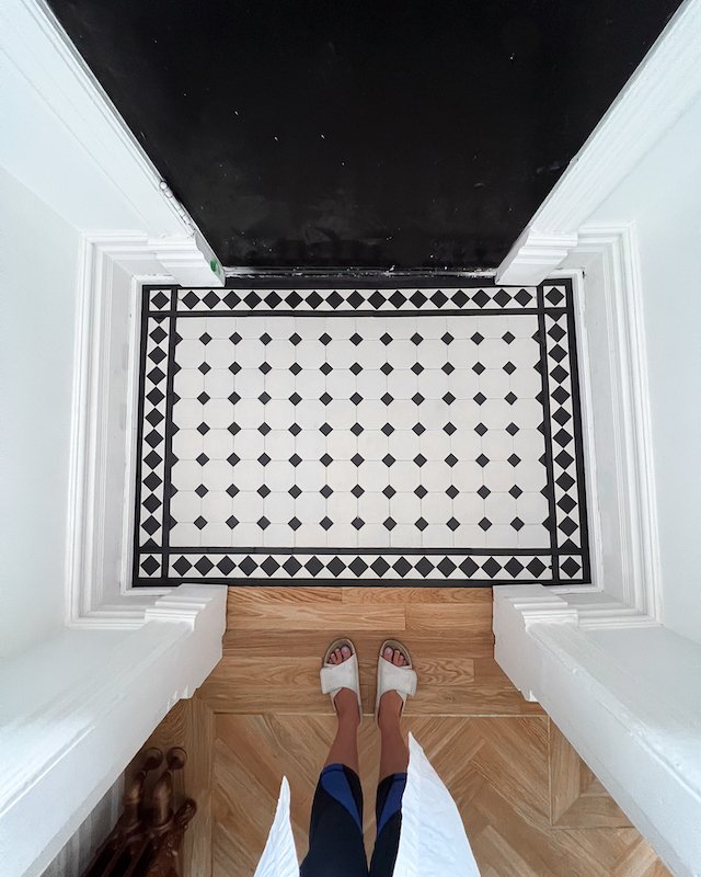 modern victorian house - home renovations toronto - victorian style house foyer tiles - winckelman tiles black and white victorian tiles with boarder design against herringbone floors-3.jpg