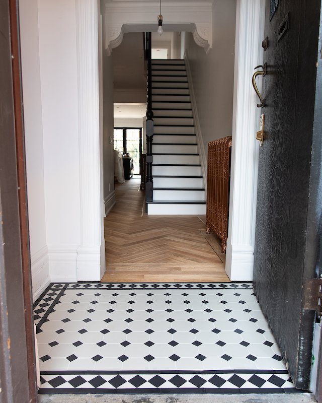 modern victorian house - home renovations toronto - foyer tiles - winckelman tiles black and white victorian tiles with boarder design-2.jpg
