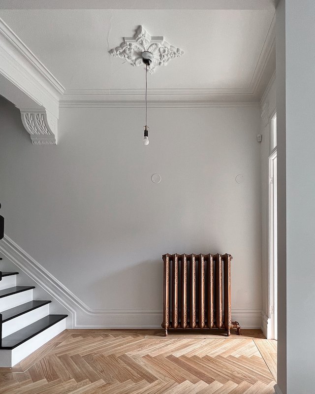 Toronto home renovations - victorian home - cast iron radiators and herringbone floors.jpg