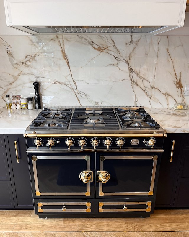 Home renovations Toronto - victorian homes - la cornue ranges - kitchen renovations toronto - herringbone floors with brass inlay - navy blue kitchen cabinets-2.jpg