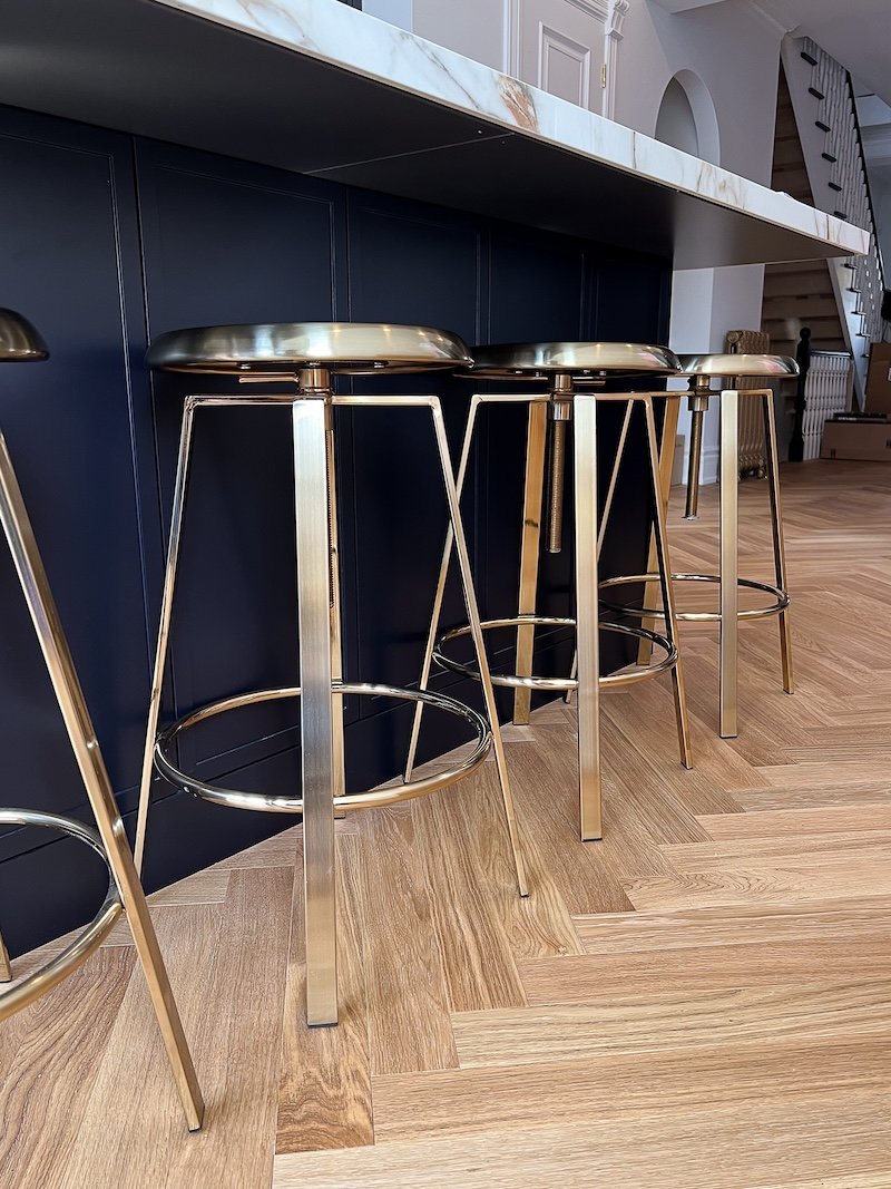 Toronto home renovations - renovating a victorian home - navy kitchen - brass bar stools.jpg