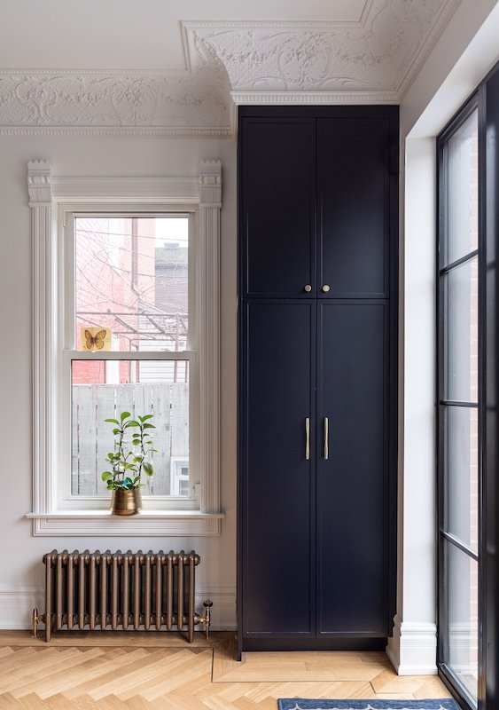 Toronto home renovations - renovating a victorian home - navy kitchen renovations - skinny shaker cabinets and crown mouldings with herringbone floors with brass inlay-2.jpg