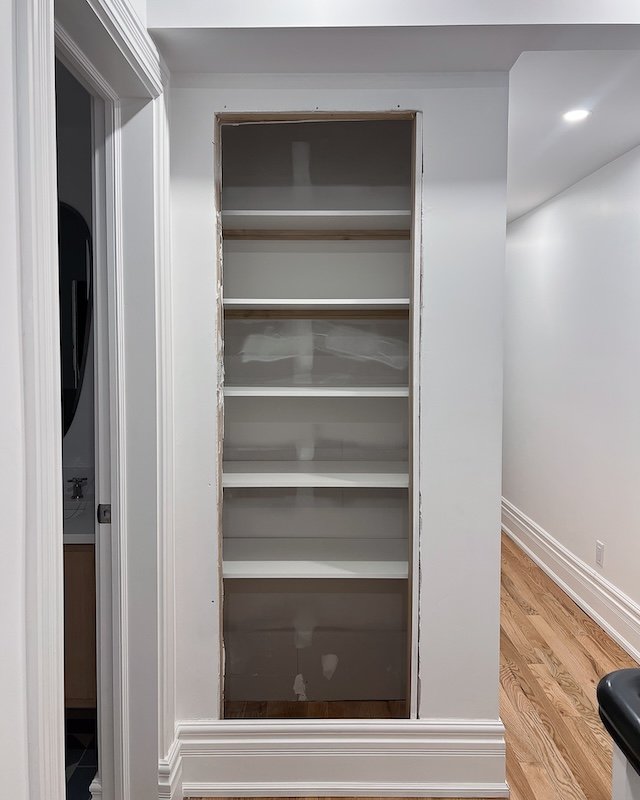 Linen Closet After Shelf Brackets Were Installed 